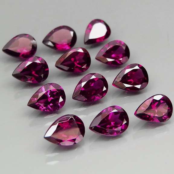 Premium pear cut 10.64ct VS Rhodolite Garnet set