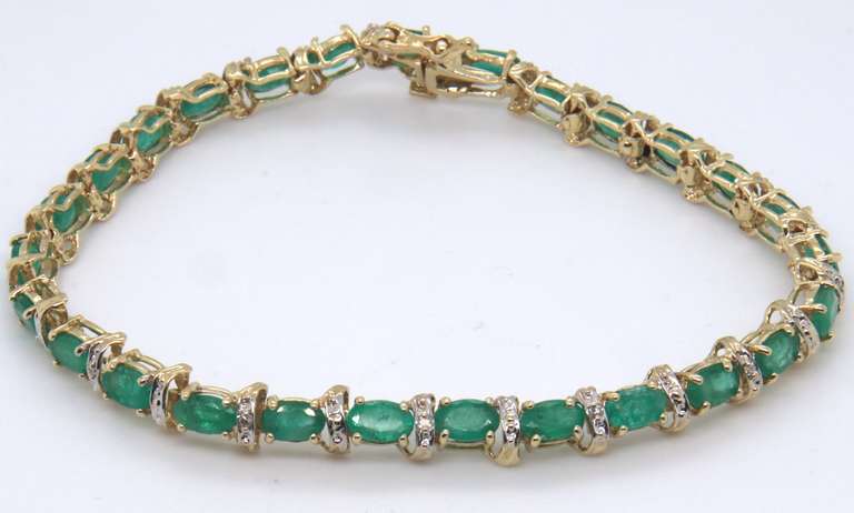 Stunning Oval Emerald and Diamond Ribbon Link Bracelet