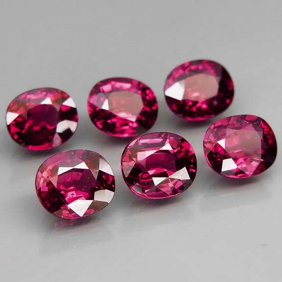 Amazing 7.32ct oval cut violet red Garnet set