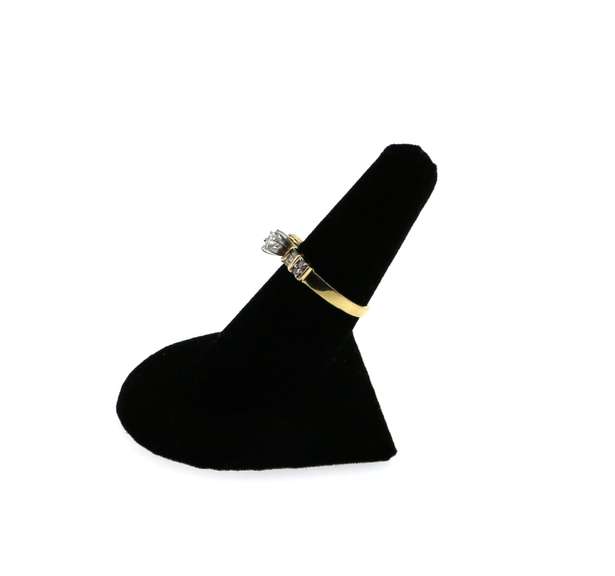 Beautiful Centerpiece Diamond Ring flanked by Round and Baguette Diamonds with 14k Gold Band