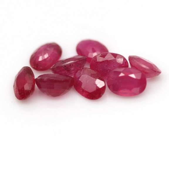 Vibrant 9.73ct oval cut reddish pink Ruby set