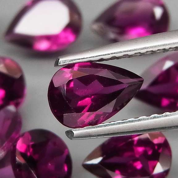 Premium pear cut 8.28ct VS Rhodolite Garnet set