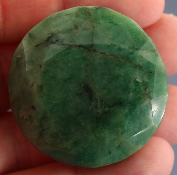 Heavy 217.5ct round cut forest green Emerald