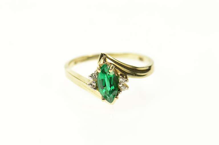 10K Yellow Gold Marquise Sim. Emerald Diamond Accent Ring