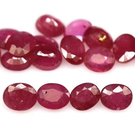 Vibrant 7.04ct oval cut imperial red Ruby set