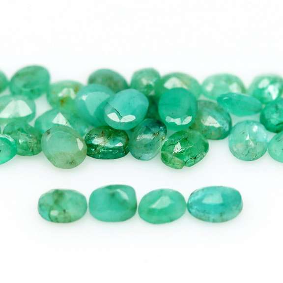 Rich emerald green 7.31ct 36pc emerald set