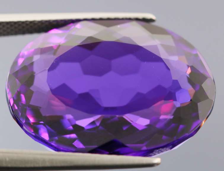 Oval cut 25.76ct royal purple created Amethyst