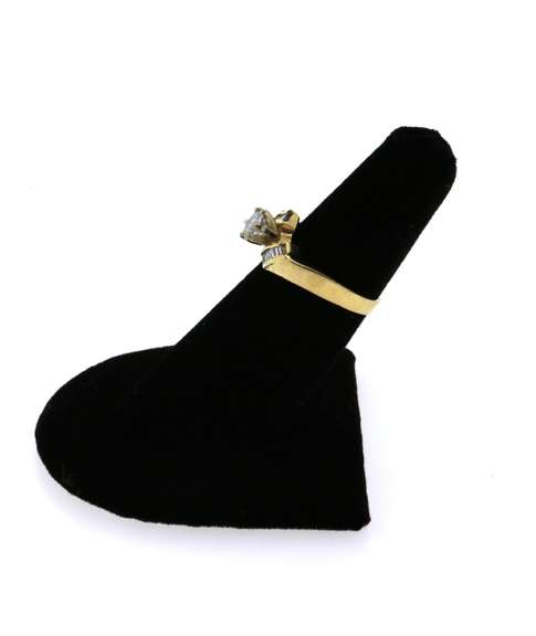 Large Diamond Ring Flanked by Baguette Diamond on a 14k Gold Band