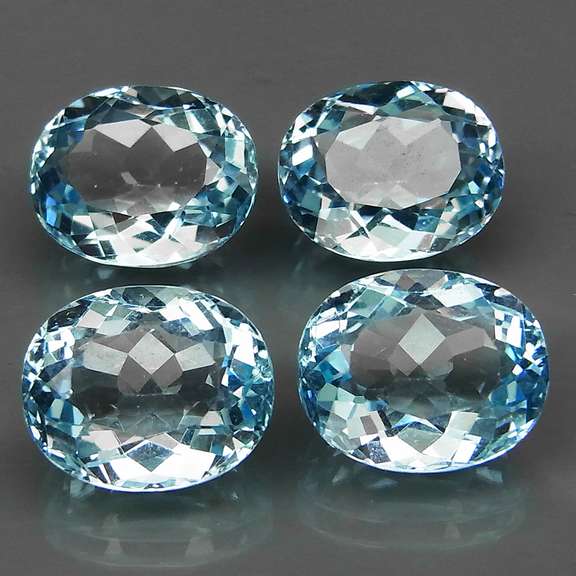 Large 18.71ct vivid sky blue Topaz set