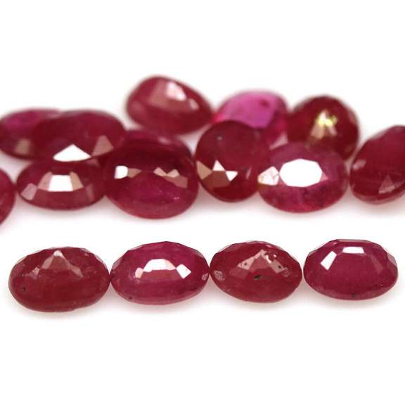 Vibrant 7.04ct oval cut imperial red Ruby set