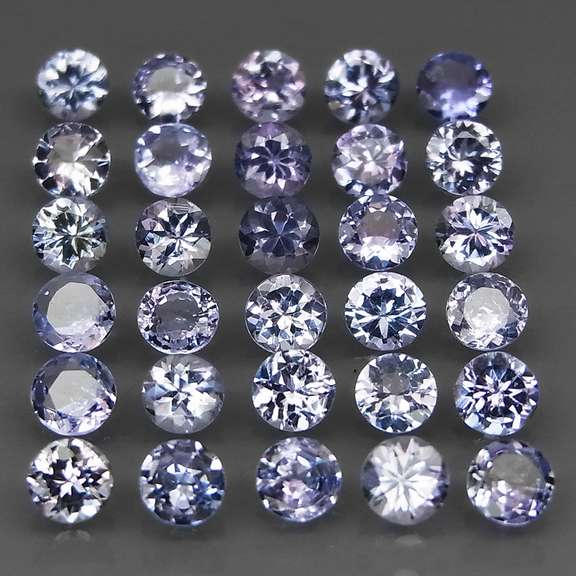 Heavy flashing 5.36ct diamond cut Tanzanite set