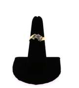 Large Diamond Ring Flanked by Baguette Diamond on a 14k Gold Band