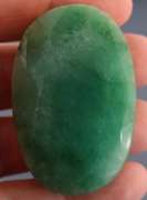 Heavy 256.5ct oval cut forest green Emerald