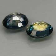 Heated only 1.37ct blue green glittering Sapphire set