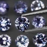 Heavy flashing 5.58ct diamond cut Tanzanite set