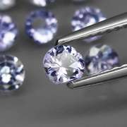 Glittering 5.61ct bright blue violet Tanzanite set