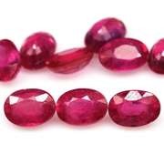 Vibrant 10.88ct oval cut reddish pink Ruby set