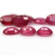 Vibrant 9.73ct oval cut reddish pink Ruby set