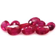 Vibrant 10.88ct oval cut reddish pink Ruby set