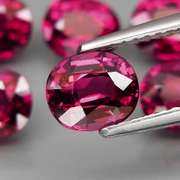 Amazing 7.32ct oval cut violet red Garnet set