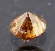 Eye catching 0.22ct smooth cut red Diamond solitaire