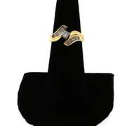 Beautiful Round Diamond Centerpiece Ring clasped by a 14k Gold band with Baguette Diamonds