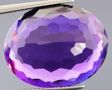 Oval cut 25.76ct royal purple created Amethyst