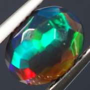 Fully faceted full panel flashing 1.55ct oval cut Black Opal