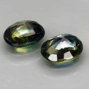 Excellent 1.49ct matched pair of blue green Sapphires