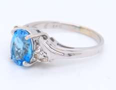 Handsome White Gold Oval Blue Topaz and Diamond Ring
