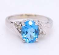 Handsome White Gold Oval Blue Topaz and Diamond Ring