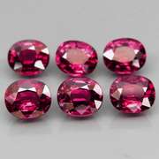 Amazing 7.32ct oval cut violet red Garnet set