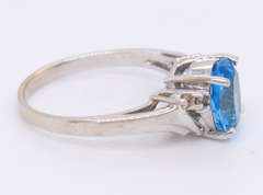 Handsome White Gold Oval Blue Topaz and Diamond Ring