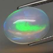 Glowing! 3.07ct rolling floral pattern Jelly Opal
