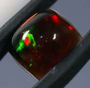 Magnificent 1.74ct pinfire flashing Black Opal
