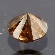 Eye catching 0.22ct smooth cut red Diamond solitaire