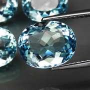 Large 17.66ct vivid sky blue Topaz set