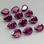 Premium pear cut 10.64ct VS Rhodolite Garnet set