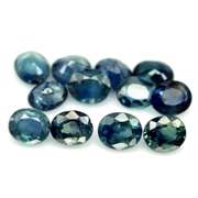 Heated only! 9.09ct blue green Sapphire set