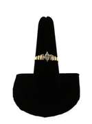 Oval Diamond Ring beset by Baguette Diamonds on a 14k Gold Band