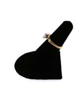 Brilliant Oval Diamond Ring flanked by Baguette Diamonds on a 14k Gold Band