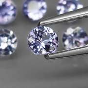 Heavy flashing 5.39ct diamond cut Tanzanite set