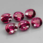 Amazing 7.32ct oval cut violet red Garnet set
