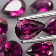 Premium pear cut 8.28ct VS Rhodolite Garnet set