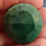 Heavy 217.5ct round cut forest green Emerald