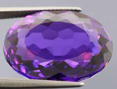Oval cut 25.76ct royal purple created Amethyst