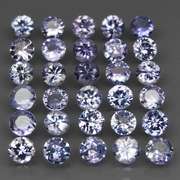 Heavy flashing 5.36ct diamond cut Tanzanite set