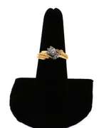 Graceful Centerpiece Round Diamond Ring encircled by stepped Diamonds on a 14k Gold Band