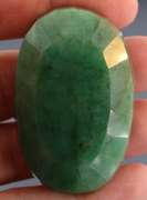 Heavy 256.5ct oval cut forest green Emerald