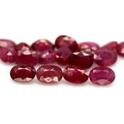 Vibrant 12.75ct oval cut imperial red Ruby set